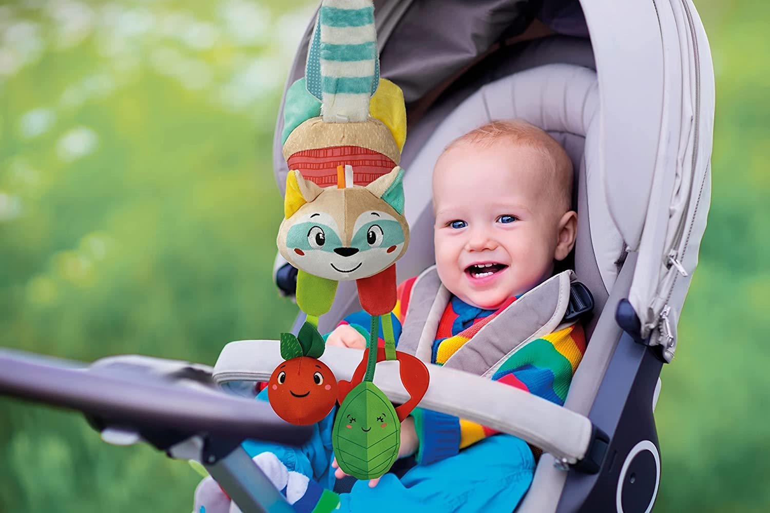 CLEMENTONI BABY Plyšový mýval s klipem na zavěšení